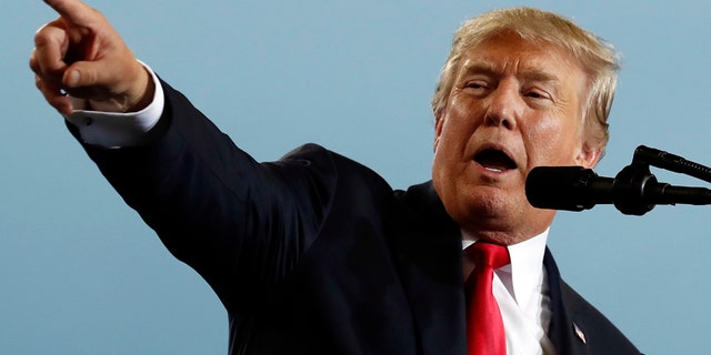 President Trump on Saturday called for his own Justice Department to publicly release who paid for a salacious dossier that includes unverified allegations about his connections with Russia.