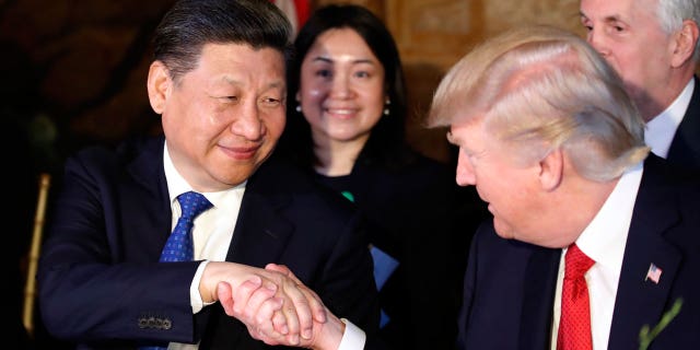Donald Trump Xi Jinping shaking hands AP FBN