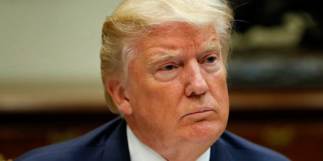 President Donald Trump listens while having lunch with services members in the Roosevelt Room of the White House in Washington, Tuesday, July 18, 2017. (AP Photo/Pablo Martinez Monsivais)