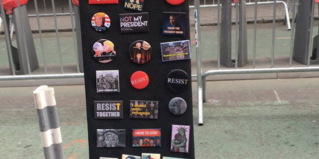 Anti-President Trump buttons were for sale at the "I Am A Muslim Too" rally.