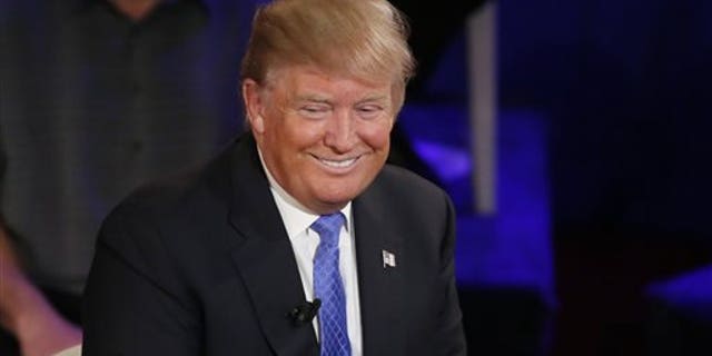 Republican presidential candidate Donald Trump smiles during a town hall in the historic Riverside Theatre on March 29, 2016, in Milwaukee. (AP Photo/Charles Rex Arbogast)