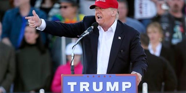 Republican presidential candidate Donald Trump points as he speaks during a rally Sunday, Feb. 28, 2016, in Madison, Ala. (AP Photo/John Bazemore)