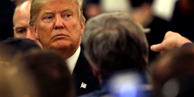Republican presidential candidate Donald Trump looks to supporters as he leaves a campaign stop Wednesday, March 30, 2016, in Appleton, Wis. (AP Photo/Nam Y. Huh)