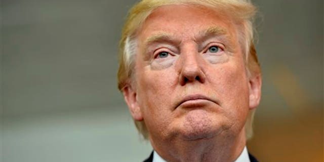 Republican presidential candidate Donald Trump listens during a news conference after speaking at the TD Convention Center, Thursday, Aug. 27, 2015, in Greenville, S.C. (AP Photo/Richard Shiro)