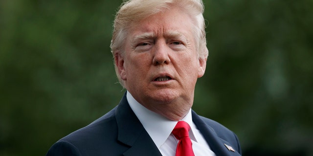 FILE -- President Donald Trump looks to the media as he walks to Marine One across the South Lawn of the White House in Washington, Saturday, April 28, 2018.