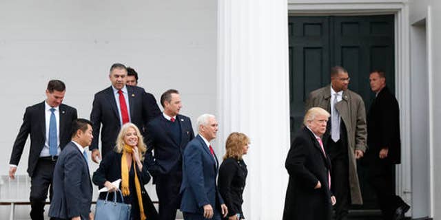 President-elect Donald Trump, foreground from right, Charlotte Pence, Vice President-elect Mike Pence, incoming White House Chief of Staff Reince Priebus and Kellyanne Conway leave services at Lamington Presbyterian Church in Bedminster, N.J., Sunday, Nov. 20, 2016. (AP Photo/Carolyn Kaster)