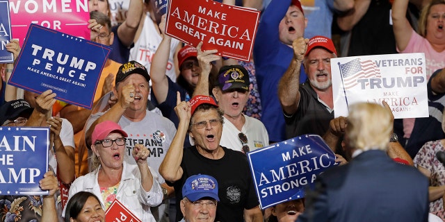 Supporters cheers for President Donald Trump as he speaks during a rally Thursday, Aug. 3, 2017, in Huntington, W.Va. (AP Photo/Darron Cummings)