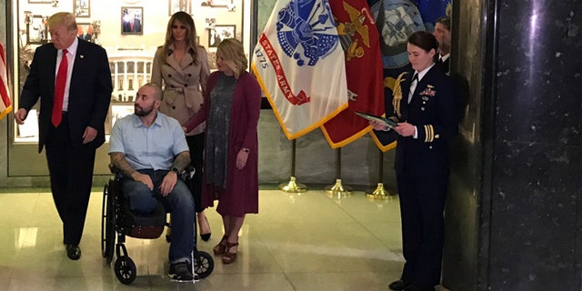 April 22, 2017: Donald Trump presents Purple Heart award to Army Sgt. Alvaro Barrietos. First lady Melania Trump and wife Tammy Barrietos are behind, to Barrietos’ left. Walter Reed National Medical Center, Bethesda, Md. (White House submitted photo.)