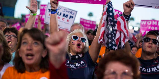 Supporters of Republican presidential candidate Donald Trump cheer during a campaign rally, Monday, Oct. 24, 2016, in Tampa, Fla. (AP Photo/ Evan Vucci)