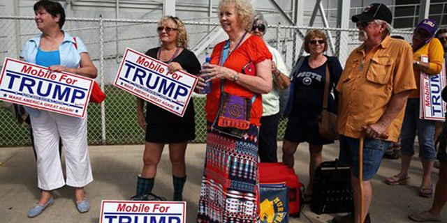 Aug. 21, 2015: Donald Trump supporters wait in line outside Ladd-Peebles Stadium hours before the start of a rally in Mobile, Ala.