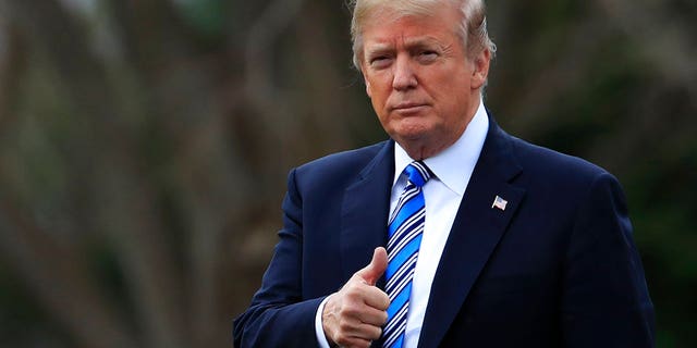 President Donald Trump gestures as he walks as he leaves the White House, Friday, Feb. 16, 2018, in Washington, for a trip to his private Mar-a-Lago resort in Florida. (AP Photo/Manuel Balce Ceneta)