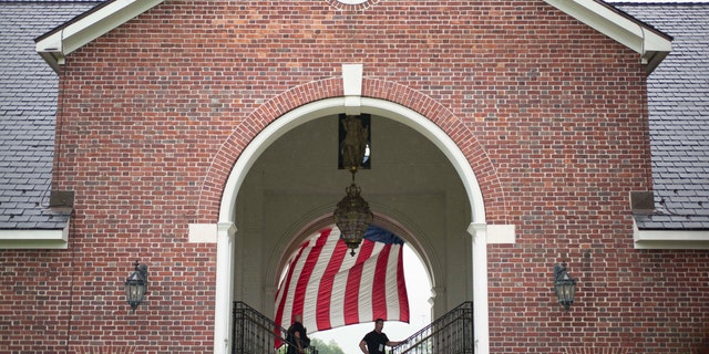 Security officers use dogs to secure the grounds in preparation for the arrival of President Trump at the Trump National Golf Club in Bedminster, New Jersey, July 14, 2017.