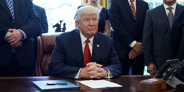 President Trump's alleged Coke button is pictured in the lower right corner of the photograph.