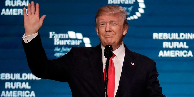 President Donald Trump waves as he speaks at the American Farm Bureau Federation annual convention Monday, Jan. 8, 2018, in Nashville, Tenn.