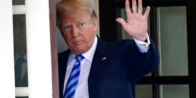FILE - In this Wednesday, May 16, 2018, file photo, U.S. President Donald Trump waves from the White House, in Washington. In a series of tweets Sunday, May 20, 2018, Trump skims over the facts involving the investigations into Russian meddling in the 2016 election. (AP Photo/Susan Walsh, File)