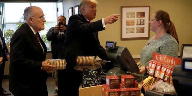Rudy Giuliani and then-presidential nominee Donald Trump stop to buy cookies at a restaurant in Pennsylvania in 2016.