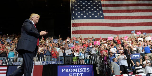 President Donald Trump arrives on stage to speak at the U.S. Cellular Center in Cedar Rapids, Iowa, Wednesday, June 21, 2017. This is Trump's first visit to Iowa since the election. (AP Photo/Susan Walsh)