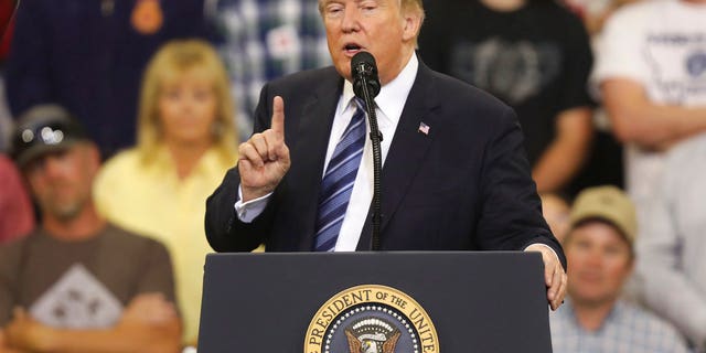President Donald Trump speaks at a rally at the Rimrock Auto Arena in Billings, Mont., Thursday, Sept. 6, 2018. (AP Photo/Jim Urquhart)