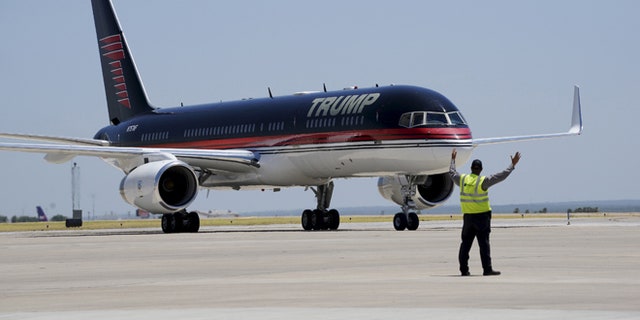 July 23, 2015: Republican presidential candidate Donald Trump arrives on his signature plane in Laredo, Texas.