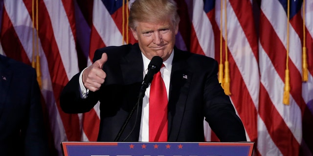 File photo - U.S. President-elect Donald Trump greets supporters during his election night rally in Manhattan, New York, U.S., November 9, 2016. (REUTERS/Mike Segar)