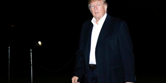 President Donald Trump walks on the South Lawn upon his return to the White House in Washington, from a five-nation Asia tour, Tuesday, Nov. 14, 2017. (AP Photo/Manuel Balce Ceneta)