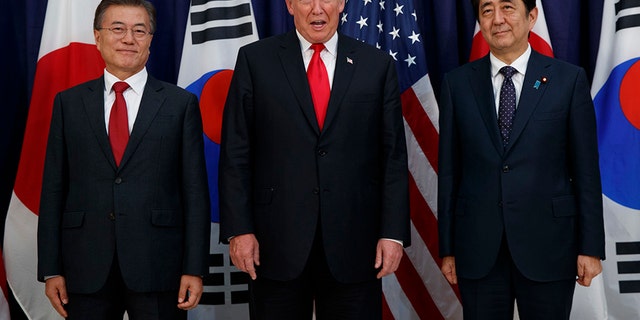 President Donald Trump meets with Japanese Prime Minister Shinzo Abe, right, and South Korean President Moon Jae-in before the Northeast Asia Security dinner at the US Consulate General Hamburg, Thursday, July 6, 2017, in Hamburg. (AP Photo/Evan Vucci)