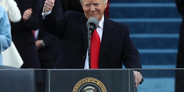U.S. President Donald Trump gives a thumbs up after being sworn in as the 45th president of the United States on the West front of the U.S. Capitol in Washington, U.S., Jan. 20, 2017. (REUTERS/Carlos Barria)