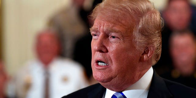 President Donald Trump responds to a reporters question during an event with sheriffs in the East Room of the White House in Washington, Wednesday, Sept. 5, 2018. (AP Photo/Susan Walsh)