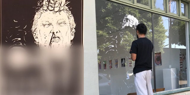 The owner of the One Grand art gallery in Portland took down a graphic image depicting President Trump with a knife to his neck with "F--- Trump" written under it.