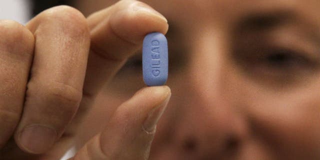 In this May 10, 2012 file photo, Dr. Lisa Sterman holds up a Truvada pill, an HIV treatment pill used to prevent infection in people at high risk of getting the AIDS virus. (AP Photo/Jeff Chiu, File)