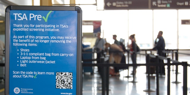 A sign listing the benefits of the TSA PreCheck security program. (AP)