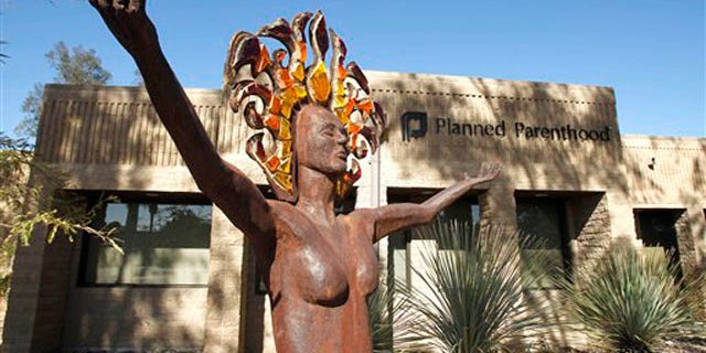 In this Jan. 23 2011 photo, a statue representing women's empowerment stands in front of a Planned Parenthood facility in Tucson, Ariz.