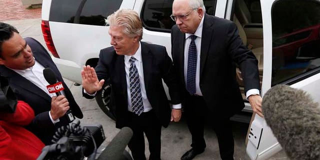 April 14, 2015: Robert Bates, right, arrives at the Tulsa County Jail with his attorney, Clark Brewster in Tulsa, Okla.