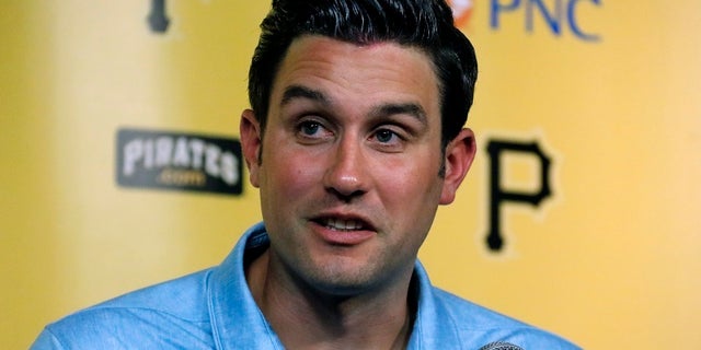 Major League umpire John Tumpane talks about a woman who hopped over a railing of the Roberto Clemente Bridge over the Allegheny River on Wednesday, June 28, 2017, in Pittsburgh. The woman told Tumpane she just wanted to get a better view of the Allegheny River below. The look on her face and the tone of her voice suggested otherwise to Tumpane. Tumpane secured one of her arms; then a bystander held her other arm, and another person clutched her legs and held them to the railing. Tumpane, Weinman and the third volunteer clung to the unidentified woman until emergency responders arrived. (AP Photo/Gene J. Puskar)