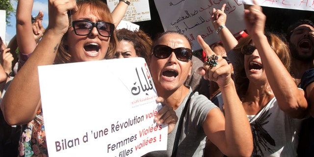 Oct. 2, 2012: Hundreds of Tunisian women protest in support of a woman who says she was raped by police and is facing accusations of violating modesty laws in Tunis.