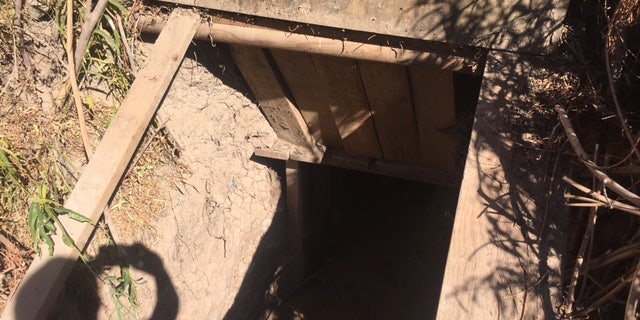 The entrance to the tunnel, it was well hidden by bushes and a cover.