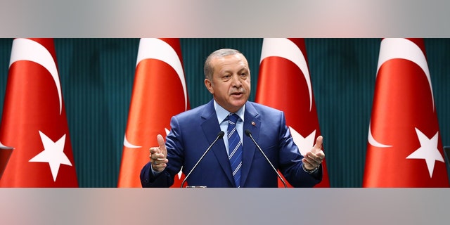 Turkish President Recep Tayyip Erdogan delivers a speech at the Presidential Palace in Ankara, Thursday, Aug. 18, 2016.