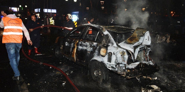 Members of emergency services work at the scene of an explosion in Ankara.