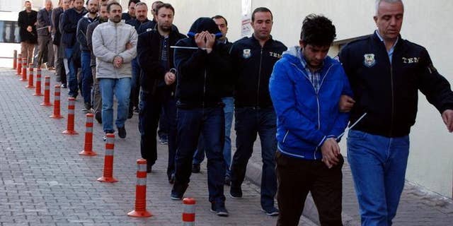 Suspected supporters of the U.S.-based cleric Fethullah Gulen escorted by plainclothes police officers at police headquarters in Kayseri, Turkey, on Tuesday.