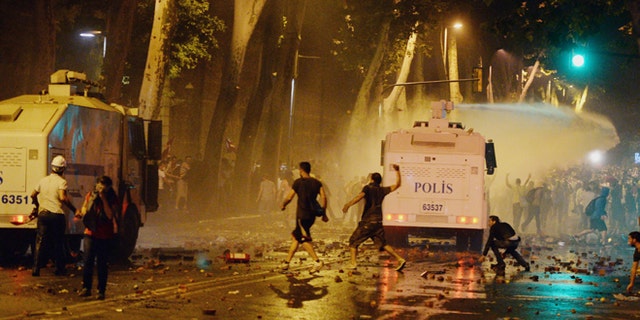 June 1, 2013 - Turkish protesters clash with riot police near the former Ottoman palace, Dolmabahce, where Turkey's Prime Minister Recep Tayyip Erdogan maintains an office in Istanbul, Turkey.