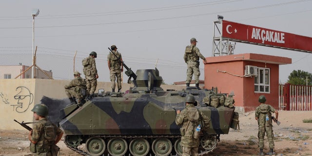 Oct. 7, 2012.: Turkish military station at the border gate with Syria, across from Syrian rebel-controlled Tel Abyad town, in Akcakale, Turkey.