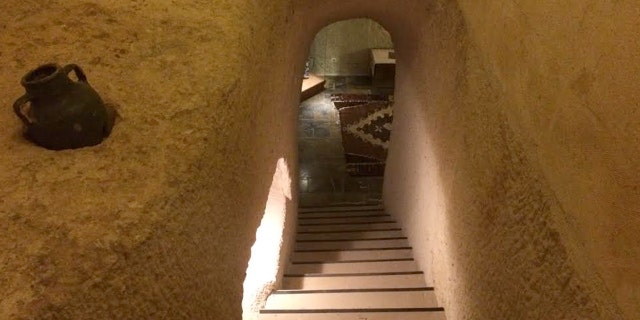 Entering your cave hotel might be a bit creepy, but once down the steps, surprises and history await.