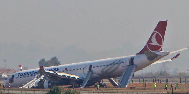 March 4, 2015: A Turkish Airlines jet is seen after it skidded off a slippery runway while landing in dense fog at Tribhuwan International Airport in Kathmandu, Nepal.