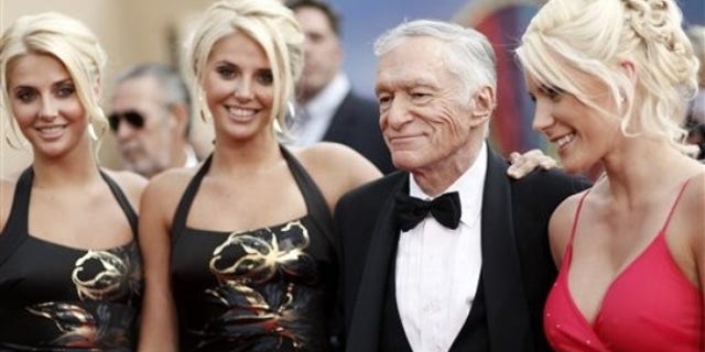 June 11, 2009: Identical twins Karissa and Kristina Shannon, Hugh Hefner, second from right, and Crystal Harris, right, arrive at the taping of the American Film Institute Life Achievement Awards honoring actor Michael Douglas in Culver City, Calif.