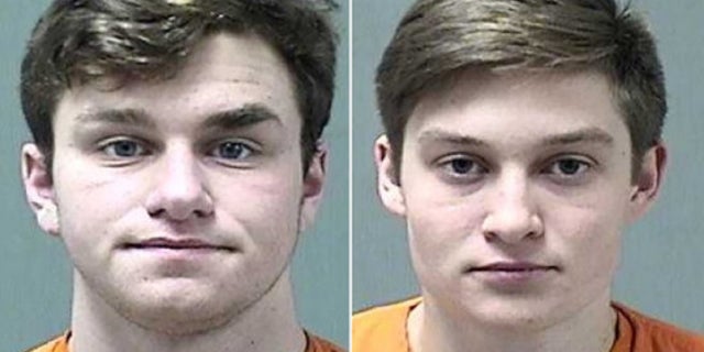 Willard Hartman (L) and Benjamin Krohn, both 19, were pulled over for a traffic stop when police found five loaded guns in the car Wednesday.