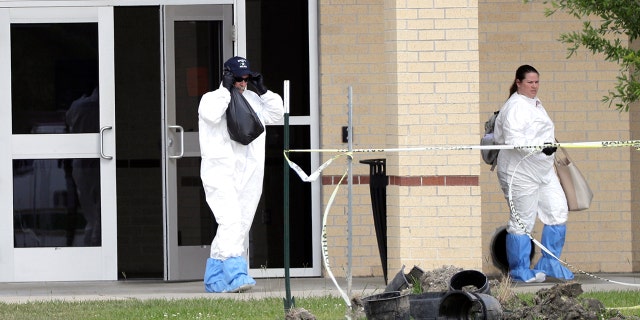 Officials remove items from Santa Fe High School.
