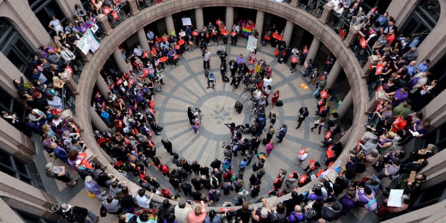 Opponents of a Texas "bathroom bill" protest in the exterior rotunda at the Texas state Capitol in Austin, March 7, 2017.