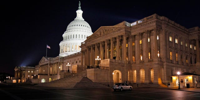 In this April 7, 2011, file photo the U.S. Capitol in Washington is illuminated at night as Congress work late to avert a government shutdown.