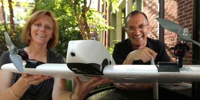 Julie Adams and Steven Wernke with the SUAVe aerial device.