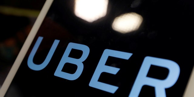 The logo of Uber is seen on an iPad, during a news conference to announce Uber resumes ride-hailing service, in Taipei, Taiwan April 13, 2017. REUTERS/Tyrone Siu - RTX35CNO